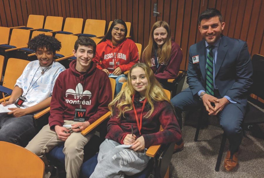 New Watertown High School principal Joel Giacobozzi (right) poses with Raider Times reporters in the lecture
hall on Jan. 30, 2020, during his daylong interview sessions when he was still one of three finalists