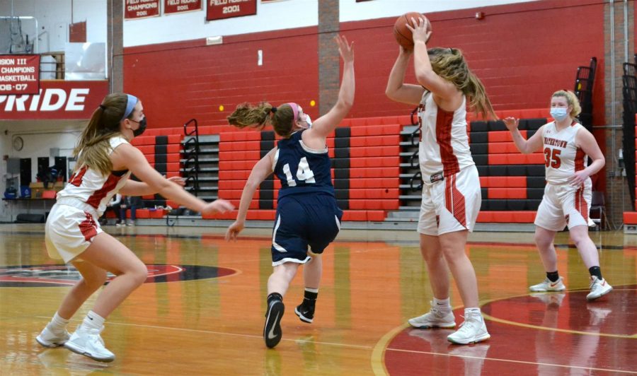 Junior Taylor Lambo (center) and her freshman sister Lily Lambo (left) play keepaway during the Watertown girls basketball teams 40-29 win over visiting Wilmington on Feb. 10, 2021.