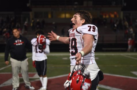 Gregory Moan (79) celebrate after Watertown beat host Melrose, 29-23, in overtime on Friday, Oct. 29, 2021.