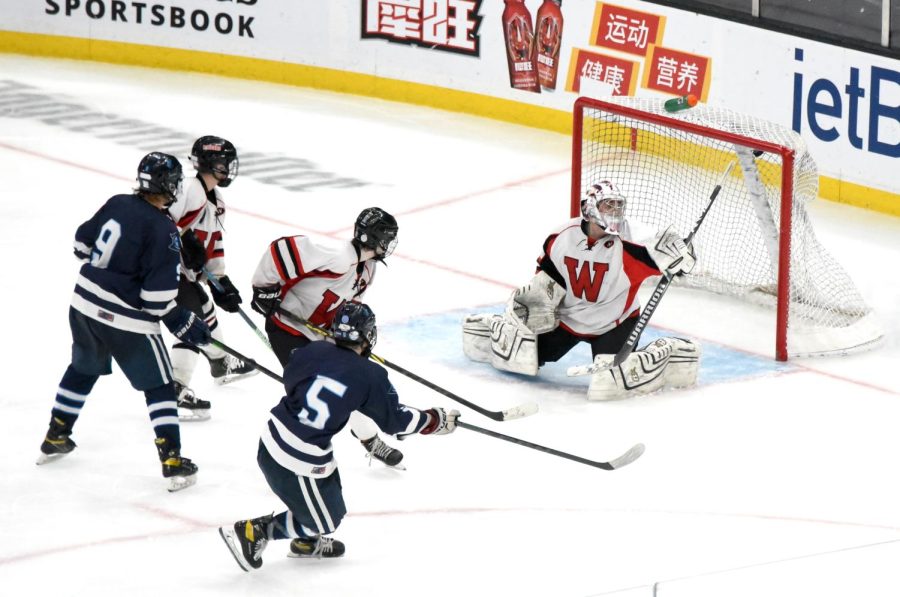 Jack Connolly (5) lets fly the winning goal, giving Sandwich a 3-2 victory over Watertown in double overtime and the MIAA Division 4 state title at TD Garden on Sunday, March 20, 2022.