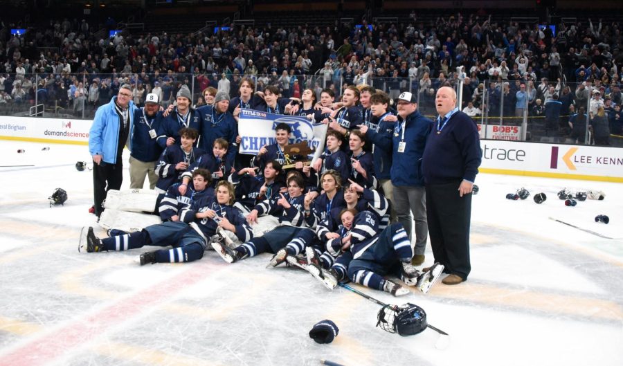 Sandwich poses for photos after its 3-2 double-overtime victory over Watertown in the MIAA Division 4 state title game at TD Garden on Sunday, March 20, 2022.