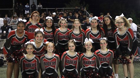 The Watertown High School cheerleading team poses for a picture during the football game at Victory Field on Sept. 16, 2022.