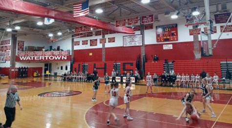 The scene inside Watertown High on Friday, March 3, where the Raiders girls basketball team (in white) defeated visiting Oakmont Regional, 44-22, in the MIAA Division 3 state tournament.