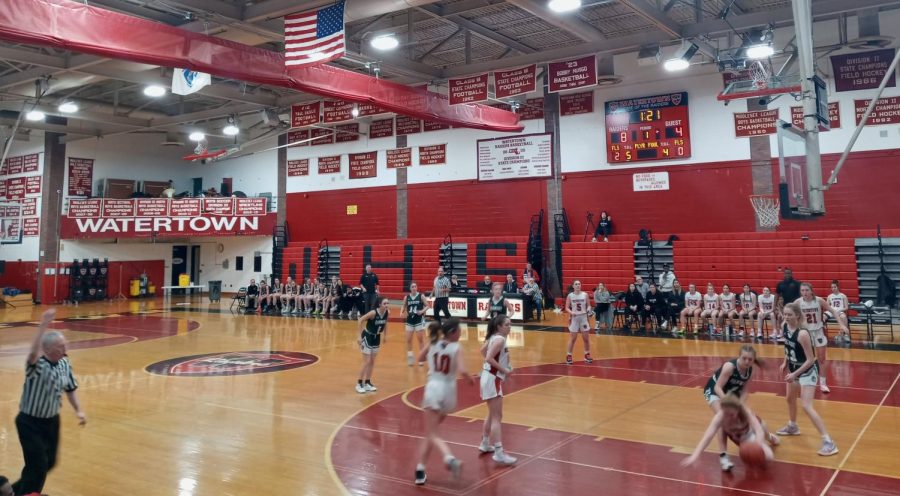The+scene+inside+Watertown+High+on+Friday%2C+March+3%2C+where+the+Raiders+girls+basketball+team+%28in+white%29+defeated+visiting+Oakmont+Regional%2C+44-22%2C+in+the+MIAA+Division+3+state+tournament.