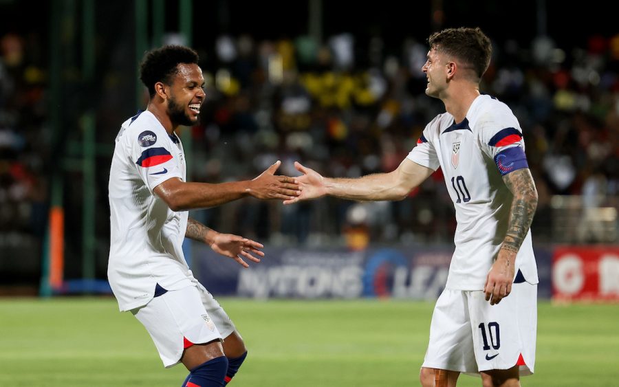 Weston McKennie (left) celebrates one of his two goals with teammate Christian Pulisic the US mens national teas 7-1 victory over host Grenada on March 24, 2023. 