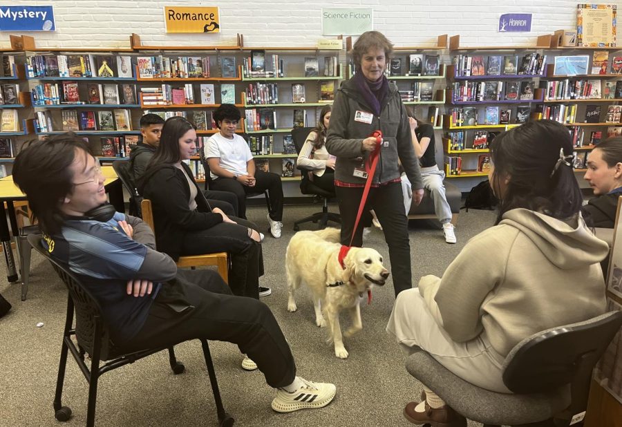 Kiki+the+therapy+dog+visiting+with+some+Watertown+High+School+students+as+part+of+SPEAK+Week+2023.